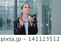 Frustrated Businesswoman Expressing Emotions on Phone Call 141123512