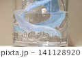 Cleaning a dental retainer with an effervescent tablet in water 141128920