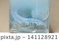 Cleaning a dental retainer in water with effervescent tablet action 141128921