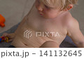 Three year old child with rash-like red dots on skin. Close-up. Slow motion. 141132645