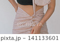 Postnatal belly wrap routine for postpartum body care. Close-up. Slow motion. 141133601