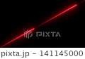 A bright glowing red laser beam line cutting diagonally across a dark black background A bright glowing red laser beam line cutting diagonally across a dark black background 141145000