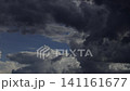 Fast-moving storm clouds create dramatic weather conditions before rainfall. 141161677