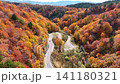 A refreshing aerial video of a car speeding along a mountain road amidst autumn foliage. A refreshing aerial video of a car speeding along a mountain road amidst autumn foliage. 141180321