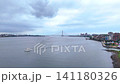 A boat navigating the Tanshui River | Drone footage showing a bridge in the distance A boat navigating the Tanshui River | Drone footage showing a bridge in the distance 141180326