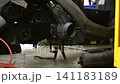 Tire replacement for mopeds; tire replacement; moped; motorcycle; repair shop; factory; mechanic; engineer 141183189