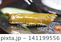 Experience traditional grape leaf dish preparation in Turkey 141199556