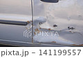 Car door damage due to accident in urban area 141199557
