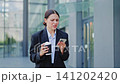 Businesswoman Reacts with Shock and Disappointment to Smartphone News 141202420