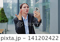 Woman Reacts Angrily During Video Call On Smartphone 141202422