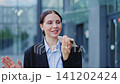 Happy Business Professional Uses Smartphone for Voice Message 141202424