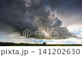 Storm clouds moving in a Timelapse. Summer storm with cumulus clouds and rain 141202630