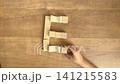 A series of 4K silent slow-motion videos showing how to complete the letter E using building blocks. 141215583