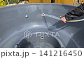 jacuzzi cleaning with water spray inside outdoor tub, 141216450