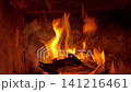 Bright fire burning wooden logs in fireplace, 141216461