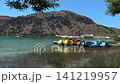 Colorful Pedal Boats on Mountain Lake 141219957