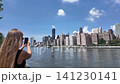 Female tourist filming manhattan skyline with smartphone 141230141