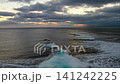 Waves crashing into the shallows 141242225