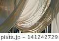 Elegant wedding ceremony drapery with pearls and soft fabric textures 141242729
