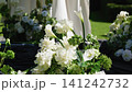 Elegant floral arrangements for wedding ceremony decoration in garden setting 141242732