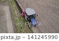 Using a blue tractor to reinforce the levees. 141245990