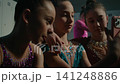 Three Young Gymnasts Making Funny Selfie on Smartphone Backstage 141248886