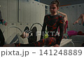 Athletic Teenage Girl Demonstrates Impressive Over Split Flexibility in Locker Room 141248889