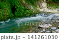 The flow of the river flowing through the valley The flow of the river flowing through the valley 141261030