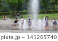 Children playing in a fountain; extreme heat; scorching heat; midsummer; water area; water play; children; people; park; hot; heatstroke; heat exhaustion 141265740