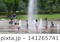 Children playing in a fountain; extreme heat; scorching heat; midsummer; water area; water play; children; people; park; hot; heatstroke; heat exhaustion 141265741