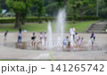 Children playing in a fountain; extreme heat; scorching heat; midsummer; water area; water play; children; people; park; hot; heatstroke; heat exhaustion 141265742