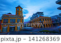 Time lapse Twilight cityscape of Phuket Old Town with its iconic clock tower surrounded by colorful colonial buildings and vibrant urban life in southern Thailand. 141268369
