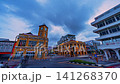 Time lapse Historic Phuket Old Town at dusk showcasing the famous clock tower, elegant heritage architecture, and moving traffic beneath a dramatic evening sky. 141268370