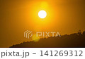 Timelapse of dramatic sunset with orange sky in a cloudy day. 141269312
