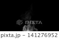 White isolated steam rises in graceful curves on a black background in slow motion. This steam trickle is perfect for overlay use with various blending modes, hot drink or food steam concepts. 141276952