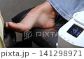 A woman's feet during a pedicure. Woman getting pedicure in beauty salon, closeup. A pedicurist working at a beauty salon. Beauty salon concept: pedicures. A woman's feet during a pedicure. Woman getting pedicure in beauty salon, closeup. A pedicurist working at a beauty salon. Beauty salon concept: pedicures. 141298971