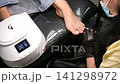 A woman's feet during a pedicure. Woman getting pedicure in beauty salon, closeup. A pedicurist working at a beauty salon. Beauty salon concept: pedicures. A woman's feet during a pedicure. Woman getting pedicure in beauty salon, closeup. A pedicurist working at a beauty salon. Beauty salon concept: pedicures. 141298972