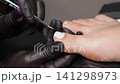 A woman's feet during a pedicure. Woman getting pedicure in beauty salon, closeup. A pedicurist working at a beauty salon. Beauty salon concept: pedicures. A woman's feet during a pedicure. Woman getting pedicure in beauty salon, closeup. A pedicurist working at a beauty salon. Beauty salon concept: pedicures. 141298973