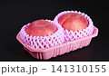 A rotating video of fresh peaches in a tray. 141310155