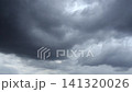 Dark storm clouds merge rapidly as severe weather develops overhead. 141320026
