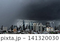 Timelapse of a stormy Bangkok cityscape beneath dense dark clouds before heavy rainfall. 141320030