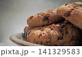 Close-up of freshly baked oatmeal cookies with chocolate chips, camera moves slowly 141329583