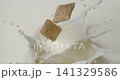 Cereal pillows falling into milk or yogurt with splash in super slow motion 1000 fps 141329586