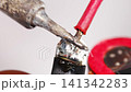 Repairing electronics with soldering techniques in a workshop 141342283