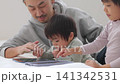 Kids playing with tablets Kids playing with tablets 141342531