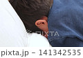 A little boy crying on his stomach A little boy crying on his stomach 141342535