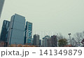 Tall buildings in the city of Chicago, the shot taken in winter with snow-covered streets showing urban life. 141349879