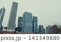 Tall buildings in the city of Chicago, the shot taken in winter with snow-covered streets showing urban life. 141349880