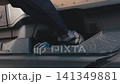 Truck driver refueling a semi truck with diesel fuel 141349881