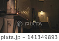 Truck driver walking at night in a warehouse loading dock 141349893